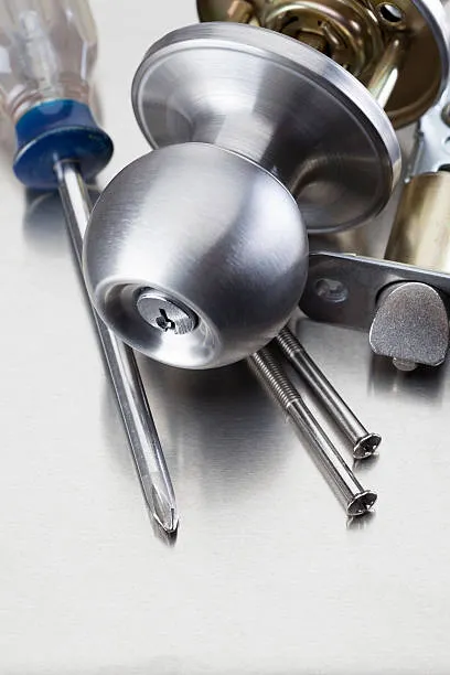 Professional locksmith checking window locks for better protection