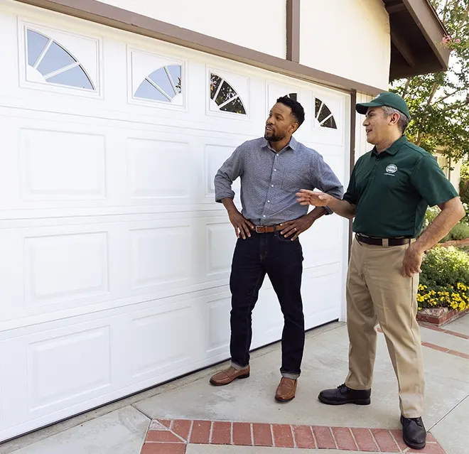 ocksmith technician reinforcing door frame for extra security